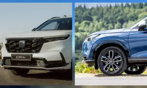 Dwa modele honda suv: biały CR-V i niebieski HR-V na tle krajobrazu.