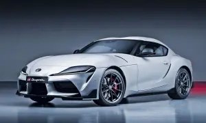 Biała Toyota GR Supra, sportowa marka samochodu na zdjęciu, prezentuje swoje aerodynamiczne linie i felgi.