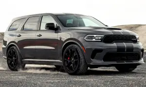 Szary Dodge Durango z czarnymi pasami, na tle pustkowia. Sprawdź jego imponujące dodge durango wymiary!