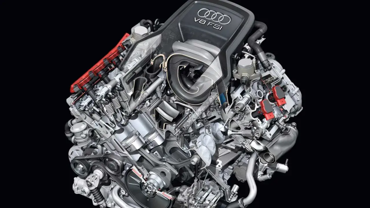 Przekrój silnika Audi V8 FSI z widocznymi tłokami, zaworami i układem wtrysku paliwa.